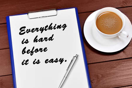 Everything is hard before it is easy written on paper. Motivational quoteの写真素材