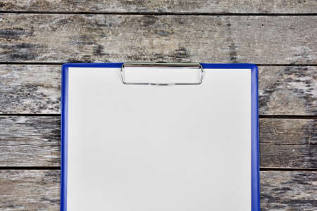 Close up of clipboard with blank white paper with penの写真素材