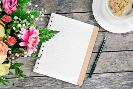 Close up of red heart ravioli with tomato, mozzarella and basil on a wood backgroundの写真素材