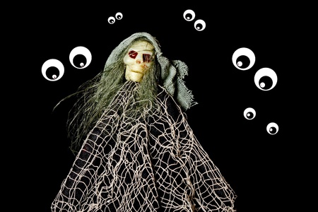 Mummy and Eyes in the dark on a black backgroundの写真素材
