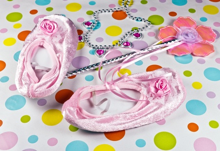 Princess Gear including wand, slippers, necklace on a polka dot background.の写真素材