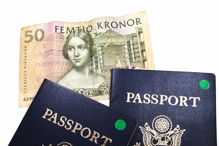 Swedish 50 Kronor bank note with 2 passports isolated with clipping pathの写真素材