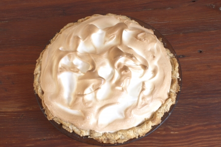 top view of meringue pie on a wooden tableの写真素材