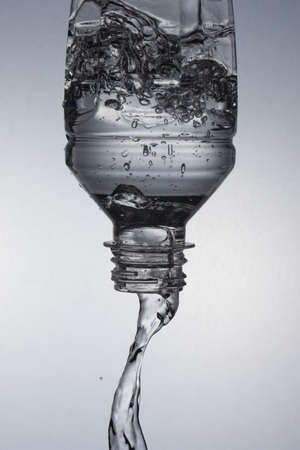 water in the bottle falling downの写真素材
