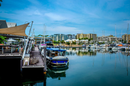 DARWIN/AUSTRALIA - NOVEMBER 28, 2016: Boats and yachts parked in the harbor with city skyline as background.のeditorial素材