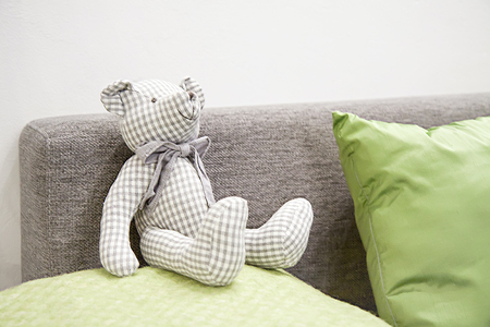 Part of the interior of the room with a teddy bearの写真素材