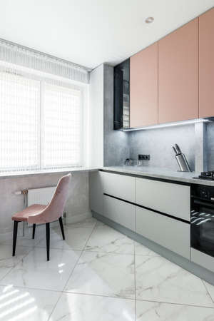 Kitchen set of peach and gray color in the new apartmentの写真素材