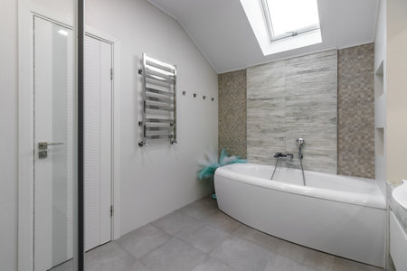 GRODNO, BELARUS -JULY, 2022: bathroom with a shower cabin, a large mirror and a chrome heater or a radiator of a towel against a white wall. Loft style in a new apartment.のeditorial素材