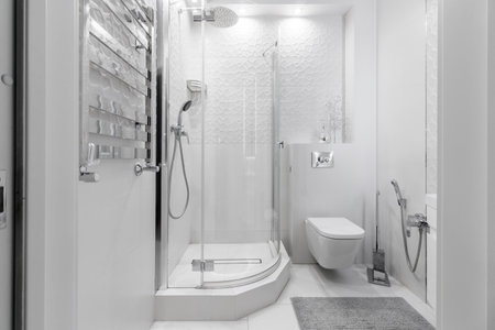 GRODNO, BELARUS -JULY, 2022: bathroom with a shower cabin, a large mirror and a chrome heater or a...