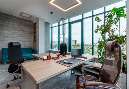 GRODNO, BELARUS - AUGUST, 2022: A spacious interior with a modern director of a panoramic window.のeditorial素材