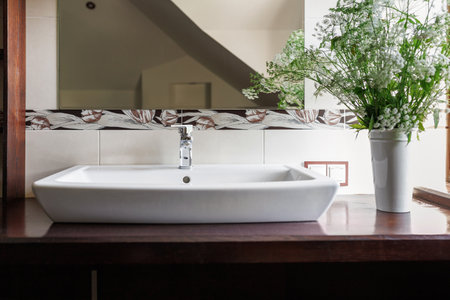 Modern bathroom interior with stylish mirror and vessel sinkの写真素材