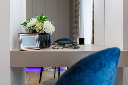 Stylish bedroom interior with an elegant toilet table and access to the balcony.の写真素材