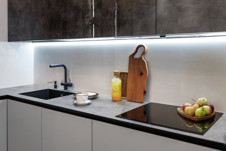 stylish decor of a modern kitchen. various items of kitchen utensils on a wooden countertop. front viewの写真素材