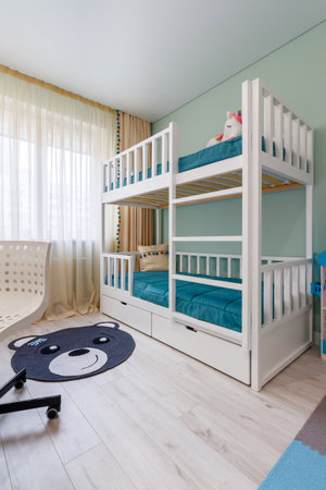 Double -tier bed for a child with decor elements, in a modern apartment.