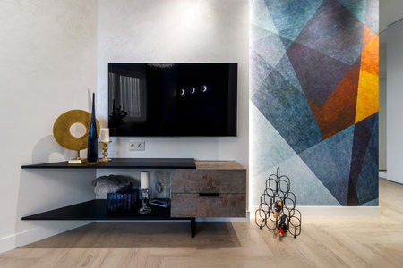 Wooden bookcase with TV set in apartment interiorの写真素材