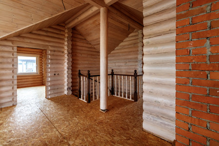 A two-story wooden cottage from the inside out in coniferous spruce pine green forest.の写真素材