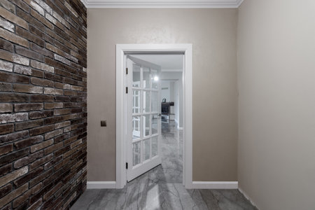 White door with glass in the center, entrance to the room.の写真素材