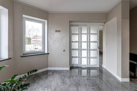 Empty house with marble floor with white french doors.の写真素材