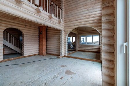 A two-story wooden cottage from the inside out in coniferous spruce pine green forest.の写真素材