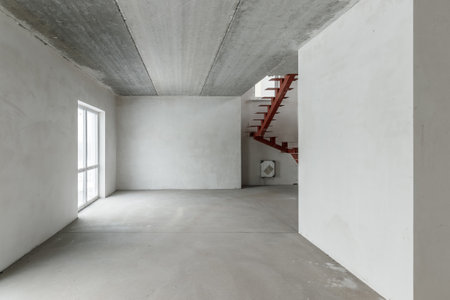 Repairs in the building. Building with a metal staircase at the time of renovation. Construction site in the house without people. Construction of a new house. construction and architecture.の写真素材