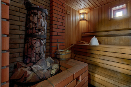 Sauna steam bath inside with stones and stove.の写真素材