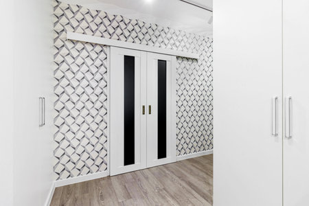 Sliding interior doors in a modern bright apartment.の写真素材