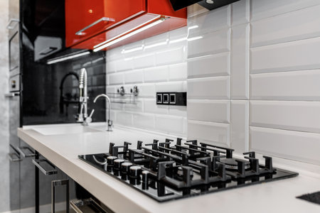 closeup, modern gas stove on countertop in contemporary modern home kitchenの写真素材