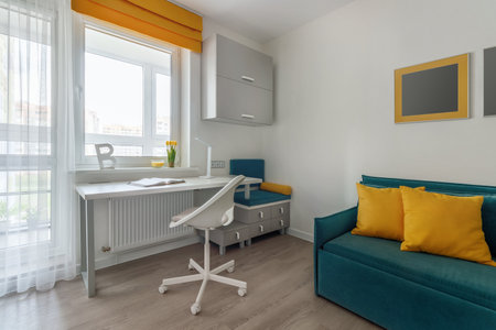 Stylish teenager's room interior with comfortable bed and workplace.の写真素材
