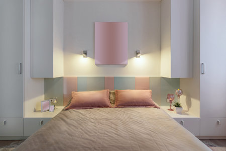 A modern bedroom in blue, pink and white colors with muffled lighting. real photo.の写真素材