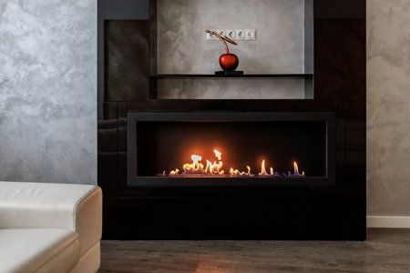 Bio Fireplace burn on ethanol gas. Contemporary mount biofuel on ethanol fireplace. Modern smart ecological alternative technologies. Interior design of a house inside.の写真素材