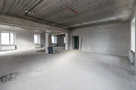 Spacious empty rooms in the attic floor after filling out the work on the wall and ceiling.の写真素材