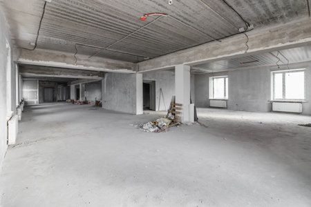 Spacious empty rooms in the attic floor after filling out the work on the wall and ceiling.の写真素材