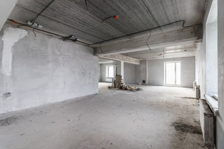 Spacious empty rooms in the attic floor after filling out the work on the wall and ceiling.の写真素材