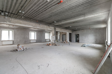 Spacious empty rooms in the attic floor after filling out the work on the wall and ceiling.の写真素材
