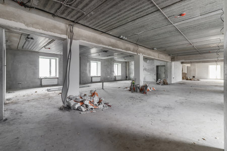 Spacious empty rooms in the attic floor after filling out the work on the wall and ceilingの写真素材