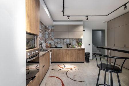 Beautiful spacious kitchen, for guests of a family hotel, with all necessary appliances.の写真素材