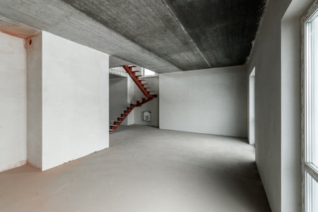 Repairs in the building. Building with a metal staircase at the time of renovation. Construction site in the house without people. Construction of a new house. construction and architecture.の写真素材