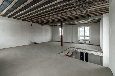 Repairs in the building. Building with a metal staircase at the time of renovation. Construction site in the house without people. Construction of a new house. construction and architecture.の写真素材