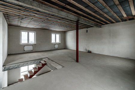 Repairs in the building. Building with a metal staircase at the time of renovation. Construction site in the house without people. Construction of a new house. construction and architecture.の写真素材