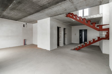 Repairs in the building. Building with a metal staircase at the time of renovation. Construction site in the house without people. Construction of a new house. construction and architecture.の写真素材
