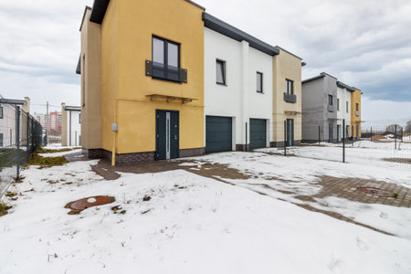 houses in residential community after snow in winter.の写真素材