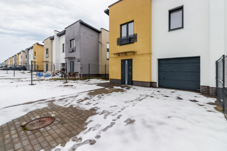houses in residential community after snow in winter.の写真素材