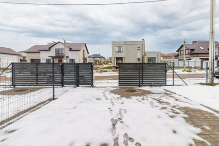 houses in residential community after snow in winter.の写真素材