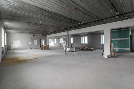 Spacious empty rooms in the attic floor after filling out the work on the wall and ceiling.の写真素材