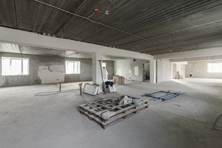 Spacious empty rooms in the attic floor after filling out the work on the wall and ceiling.の写真素材