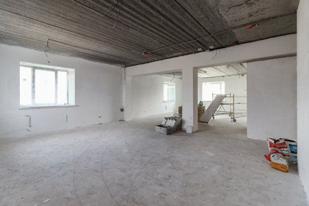 Spacious empty rooms in the attic floor after filling out the work on the wall and ceiling.の写真素材