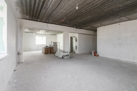 Spacious empty rooms in the attic floor after filling out the work on the wall and ceiling.の写真素材