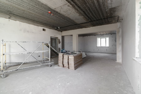 Spacious empty rooms in the attic floor after filling out the work on the wall and ceiling.の写真素材