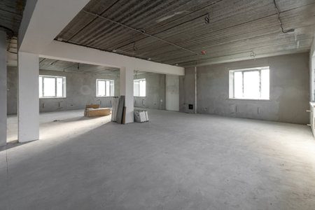 Spacious empty rooms in the attic floor after filling out the work on the wall and ceiling.の写真素材