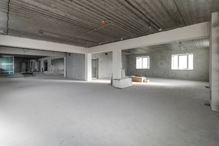 Spacious empty rooms in the attic floor after filling out the work on the wall and ceiling.の写真素材